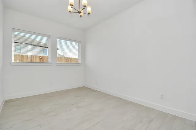 a view of a kitchen with a sink and a refrigerator