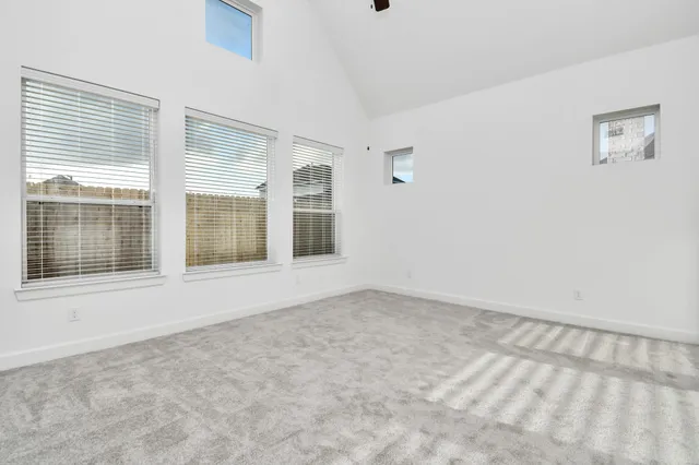 a spacious bathroom with a tub sink and mirror