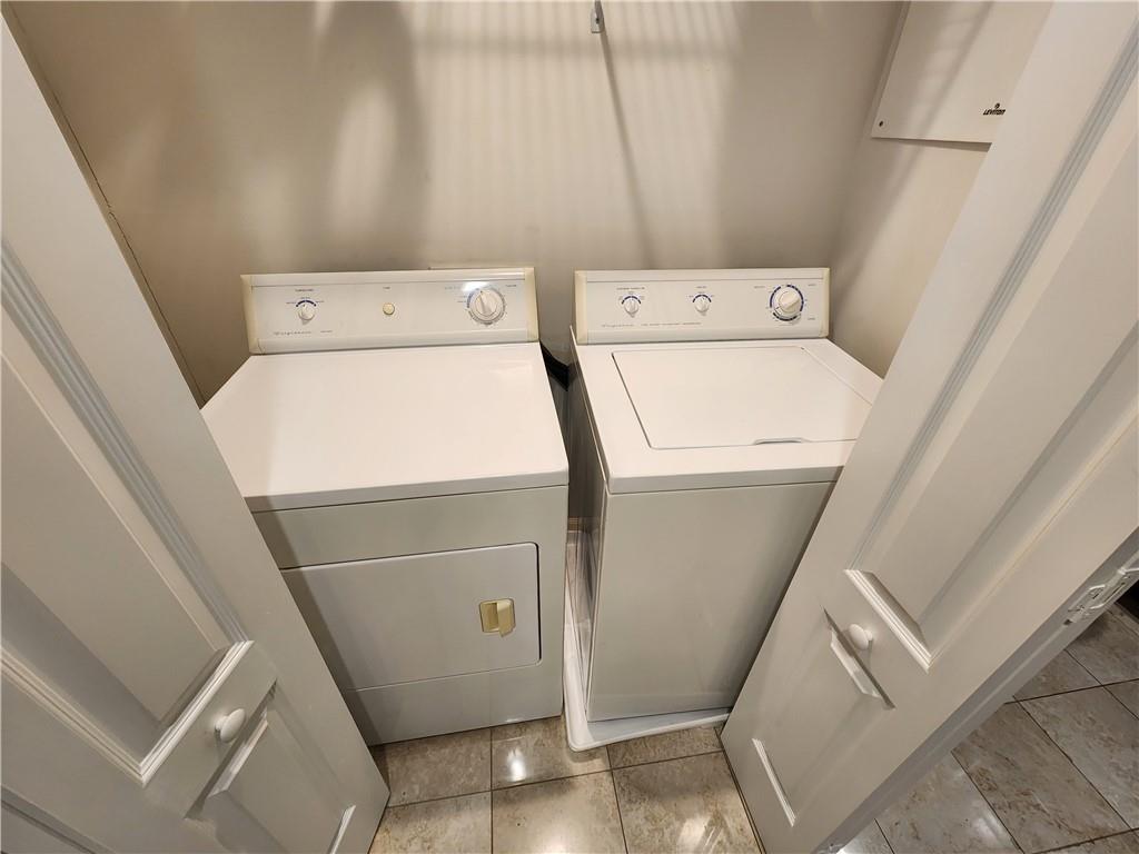 195 14th Street Northeast, Unit 304 Atlanta, GA 30309 - Photo 13 of 25 a utility room with dryer and washer