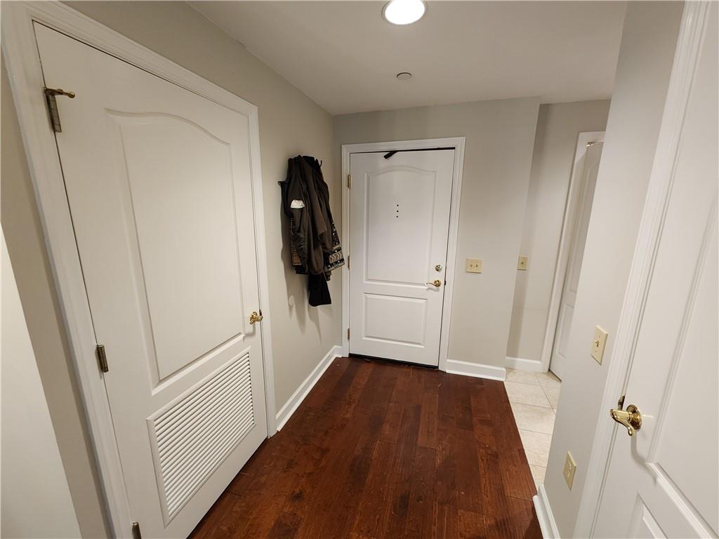 195 14th Street Northeast, Unit 304 Atlanta, GA 30309 - Photo 17 of 25 a view of hallway with walk in closet and wooden floor