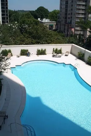a view of a house with a yard porch and sitting area