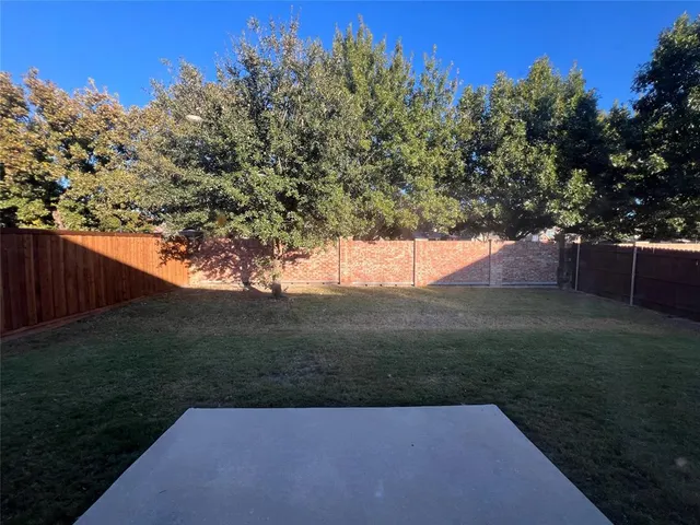 a view of a yard with an trees