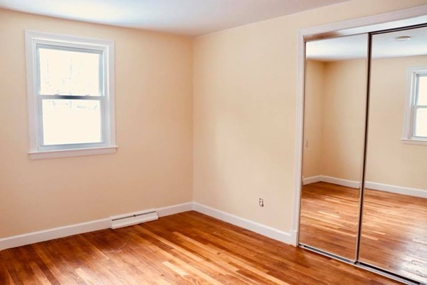 144 Salem Road Billerica, MA 01821 - Photo 12 of 16 a view of empty room with wooden floor and fan