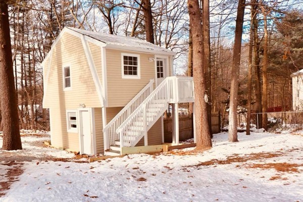 144 Salem Road Billerica, MA 01821 - Photo 2 of 16 a view of a house with snow on the road