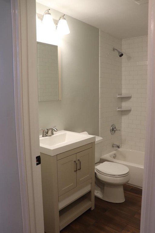 144 Salem Road Billerica, MA 01821 - Photo 9 of 16 a bathroom with a sink toilet and shower