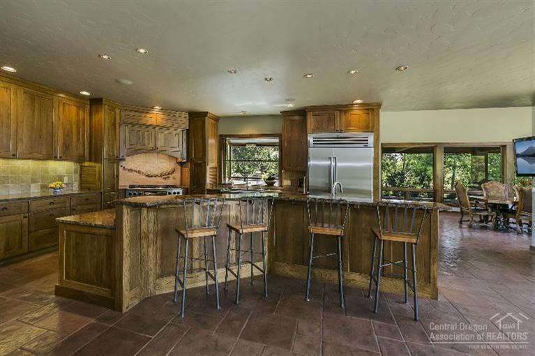 64245 Schibel Road Bend, OR 97703 - Photo 6 of 18 a kitchen with a table and chairs in it