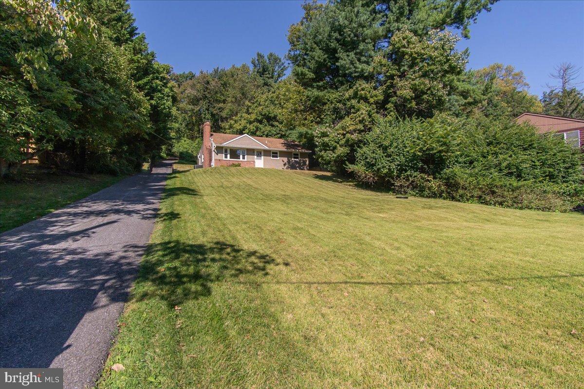 8108 Edgewood Church Road Frederick, MD 21702 - Photo 6 of 37 Charming home nestled in lush greenery.