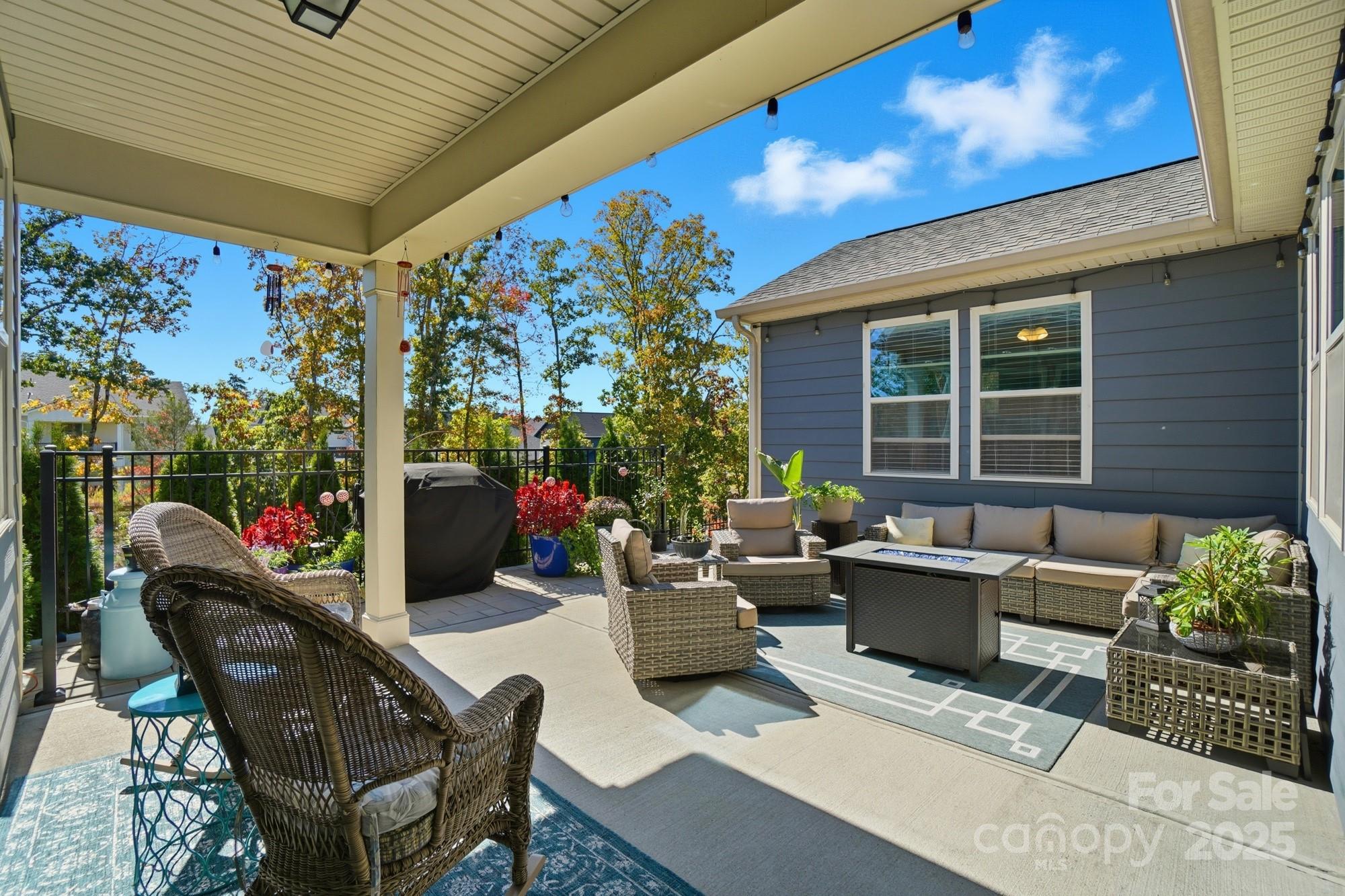 1296 Independence Street Tega Cay, SC 29708 - Photo 20 of 27 a view of a patio with couches and potted plants
