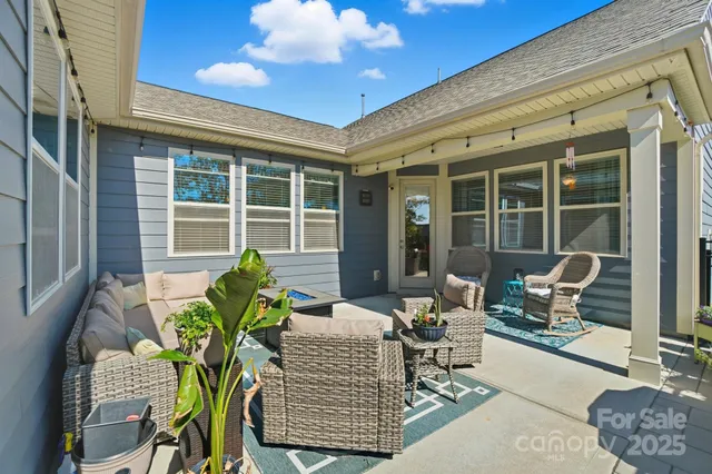 a outdoor living space with furniture and a potted plant