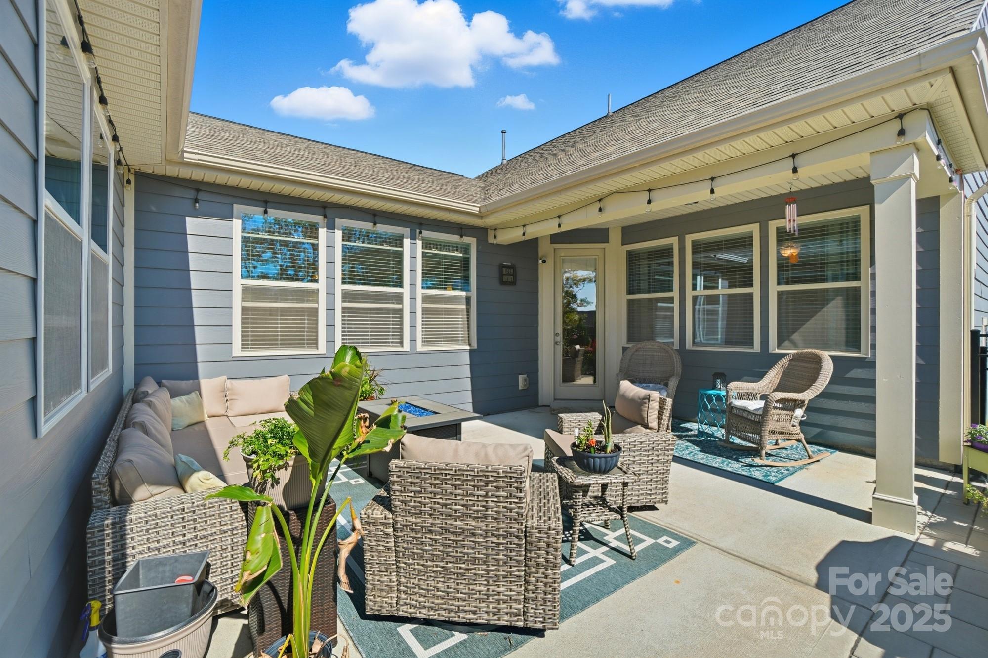 1296 Independence Street Tega Cay, SC 29708 - Photo 21 of 27 a outdoor living space with furniture and a potted plant