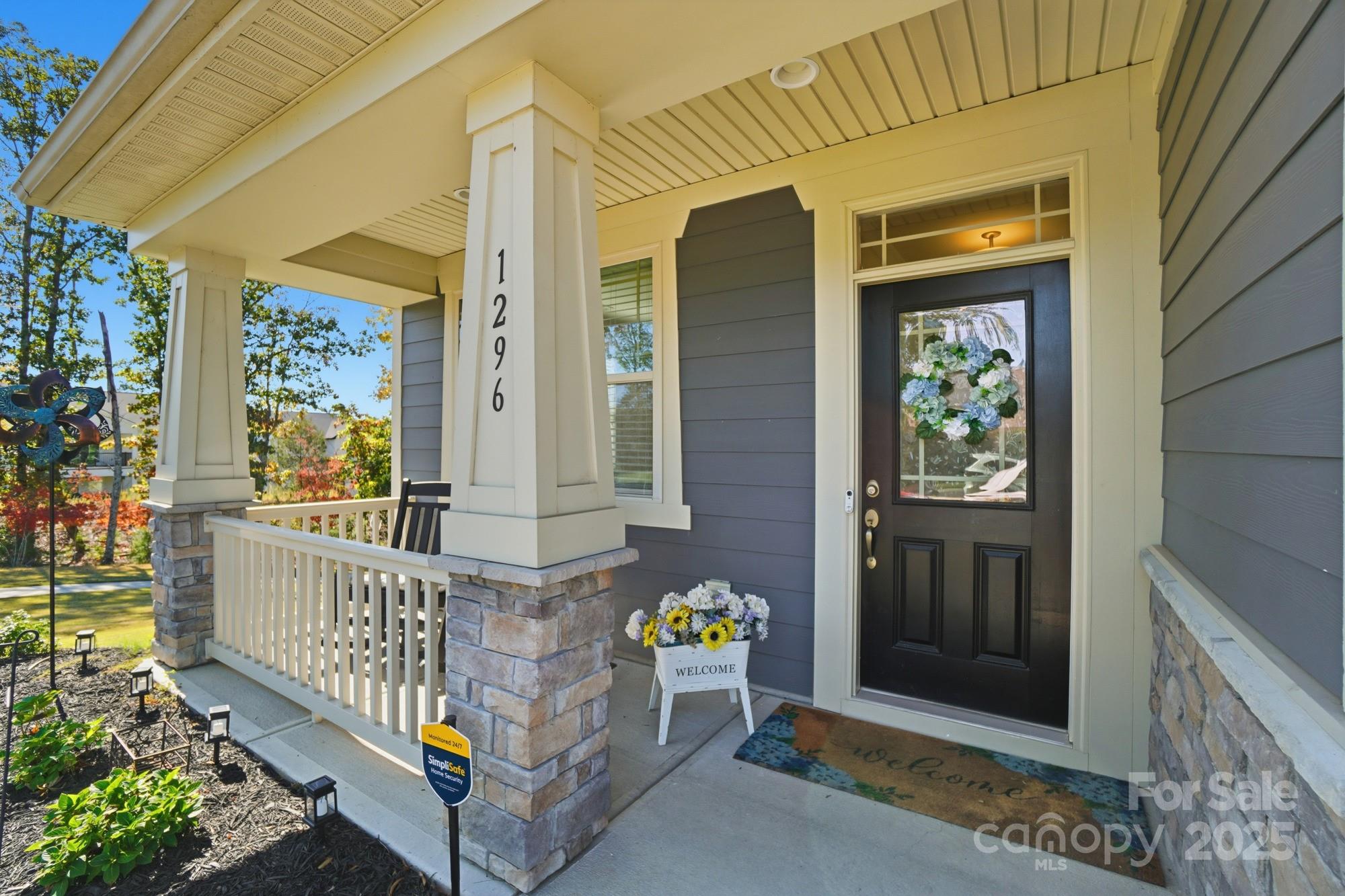 1296 Independence Street Tega Cay, SC 29708 - Photo 3 of 27 a view of a porch with furniture