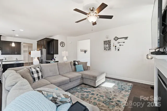 a living room with furniture and a rug