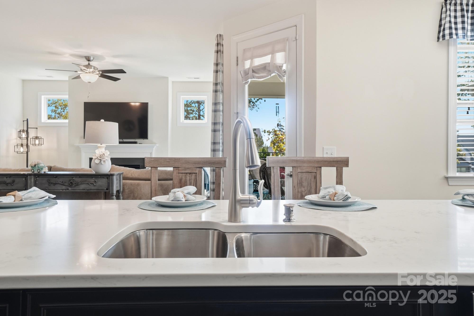1296 Independence Street Tega Cay, SC 29708 - Photo 9 of 27 a kitchen with a sink and a mirror