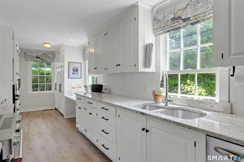 a kitchen that has a sink and a window