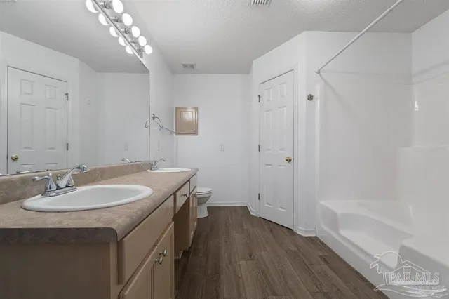 a bathroom with a sink a vanity and a mirror
