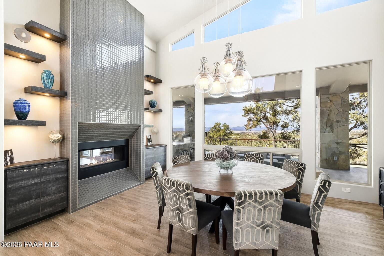 5245 West Three Forks Road Prescott, AZ 86305 - Photo 12 of 68 a view of a dining room with furniture and chandelier