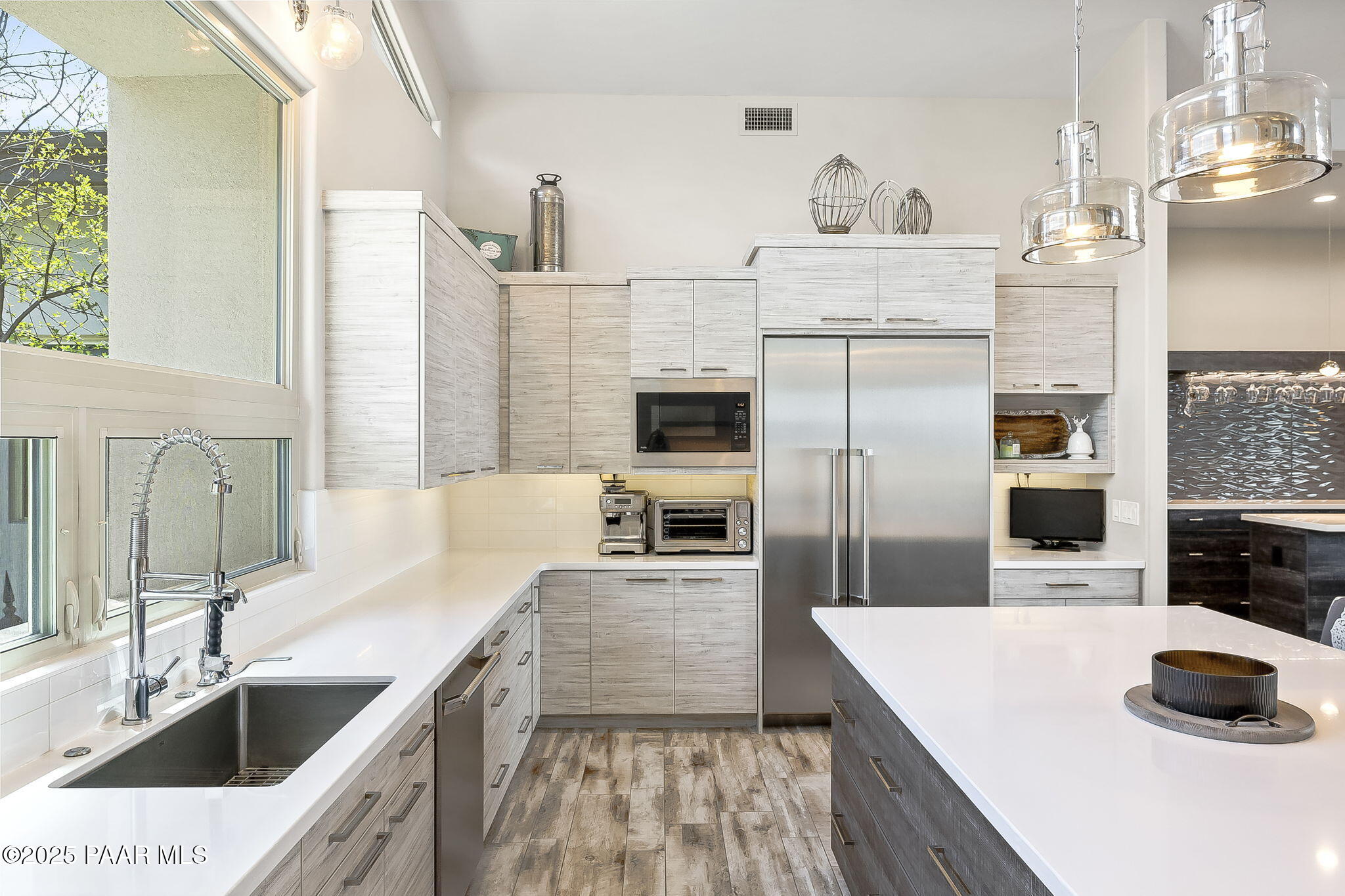 5245 West Three Forks Road Prescott, AZ 86305 - Photo 22 of 68 a kitchen with stainless steel appliances kitchen island granite countertop a sink stove and refrigerator