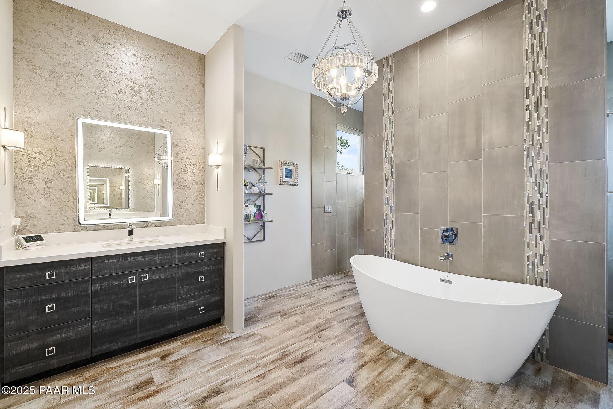 5245 West Three Forks Road Prescott, AZ 86305 - Photo 31 of 68 a spacious bathroom with a tub sink and mirror