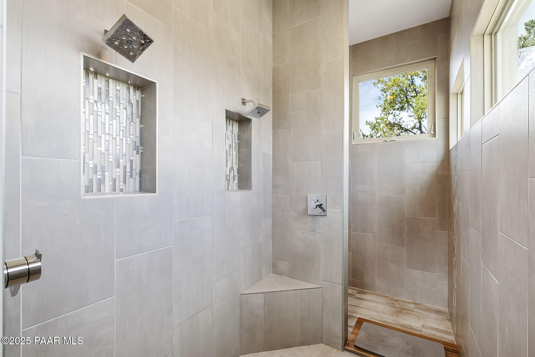 5245 West Three Forks Road Prescott, AZ 86305 - Photo 32 of 68 a bathroom with a window a toilet and shower