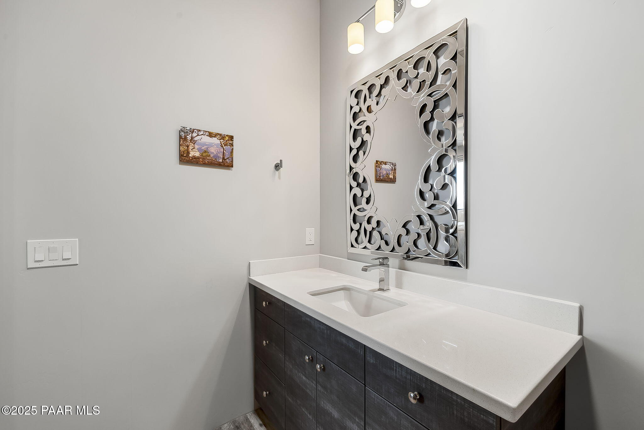 5245 West Three Forks Road Prescott, AZ 86305 - Photo 44 of 68 a bathroom with a sink and a mirror