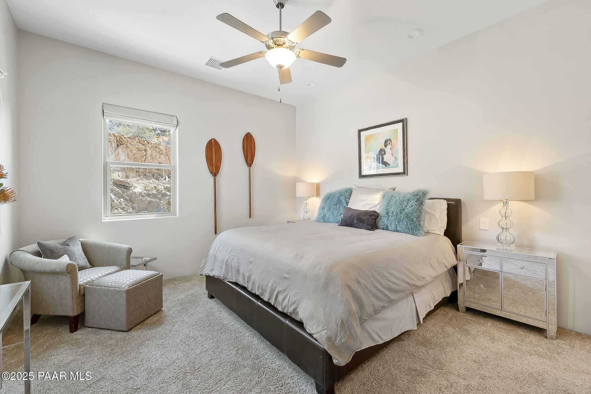 5245 West Three Forks Road Prescott, AZ 86305 - Photo 46 of 68 a bedroom with a bed and a couch