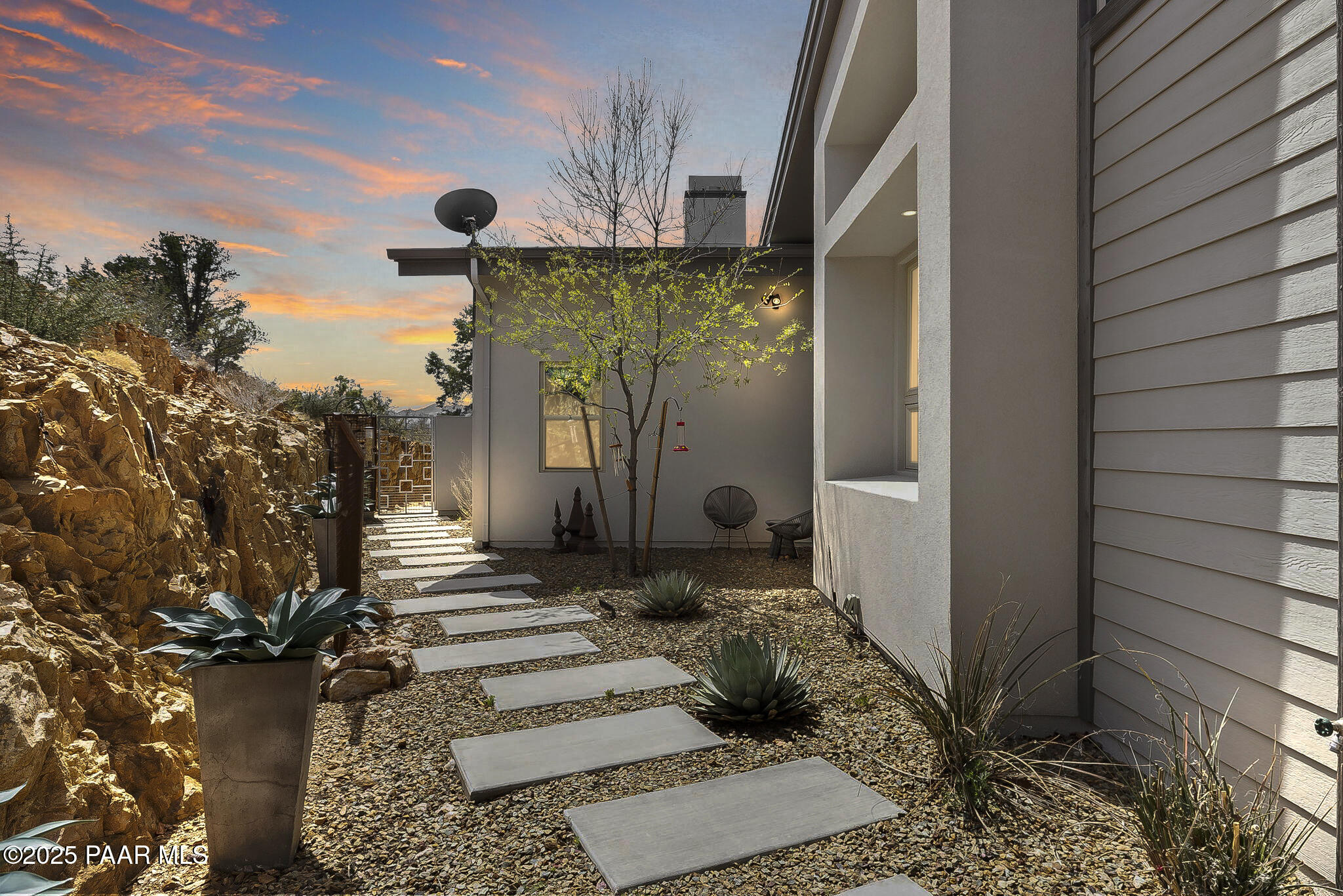 5245 West Three Forks Road Prescott, AZ 86305 - Photo 5 of 68 a potted plant sitting in front of a house