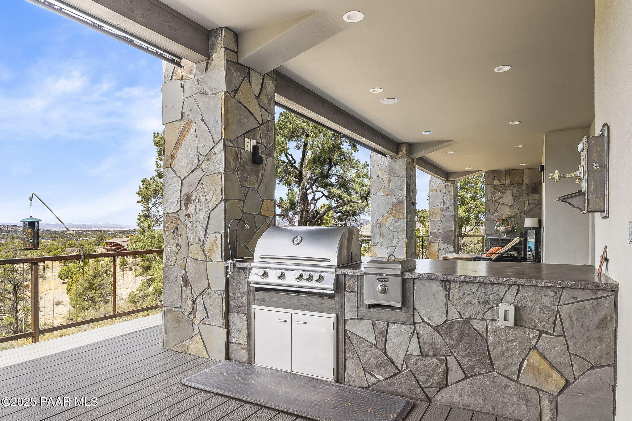 5245 West Three Forks Road Prescott, AZ 86305 - Photo 52 of 68 a kitchen with stainless steel appliances granite countertop a stove and a refrigerator