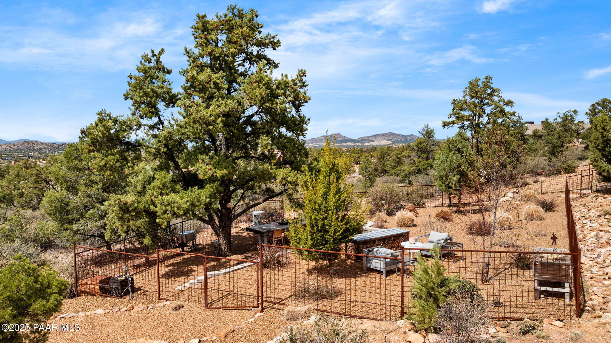 5245 West Three Forks Road Prescott, AZ 86305 - Photo 57 of 68 a backyard of a house with lots of green space