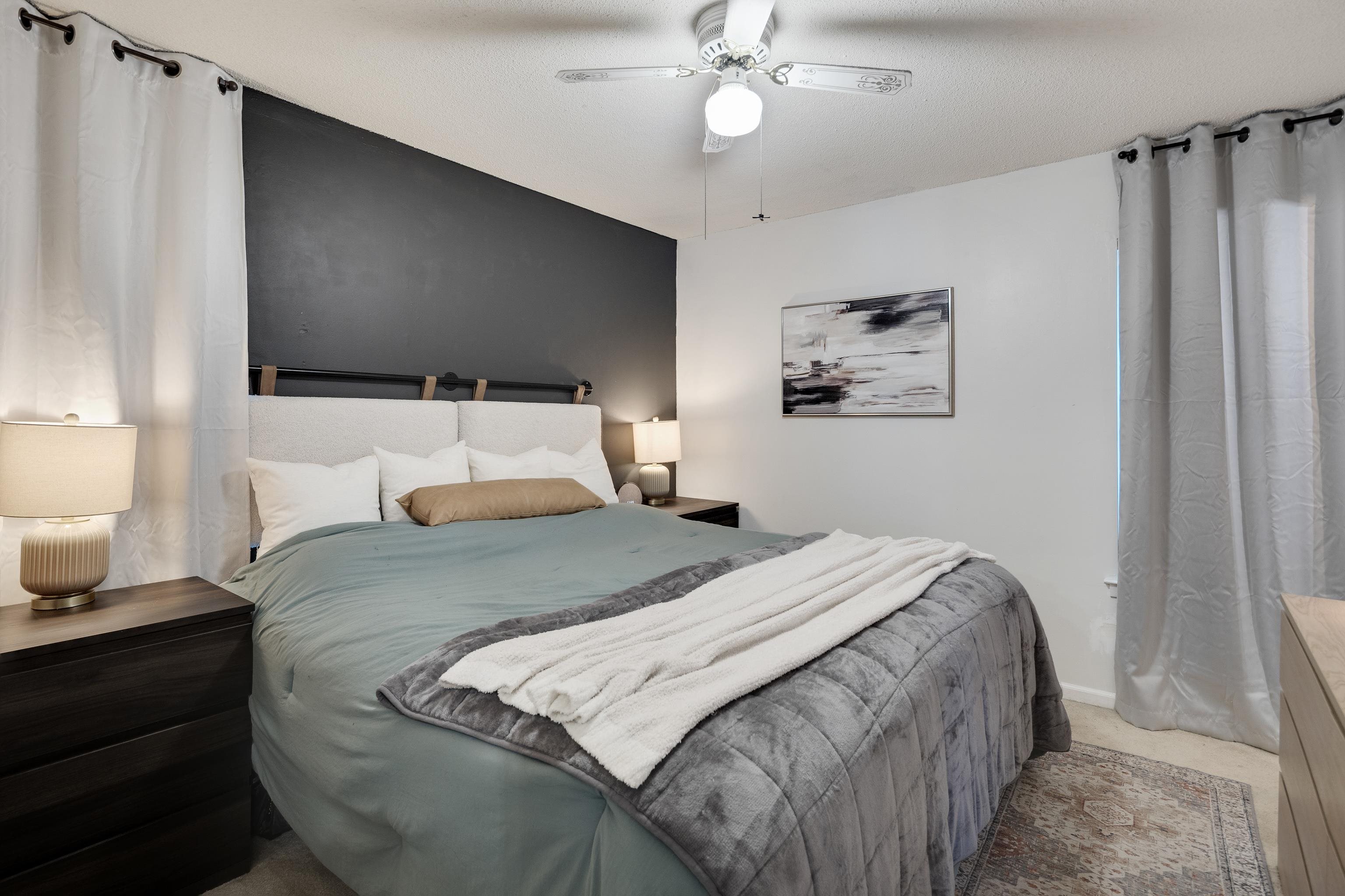 1137 Greenview Road Collierville, TN 38017 - Photo 23 of 35 a bedroom with bed tv and a window