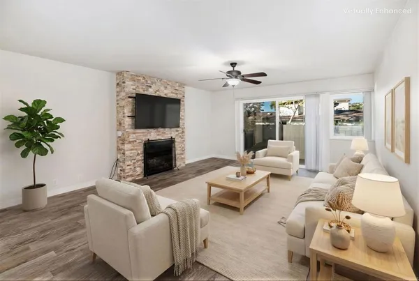 a living room with furniture fireplace and a flat screen tv