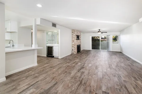 a view of a kitchen with wooden floor