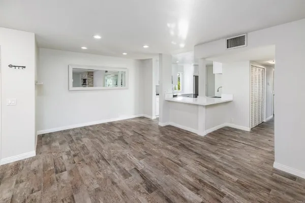 a view of kitchen with wooden floor and outdoor space