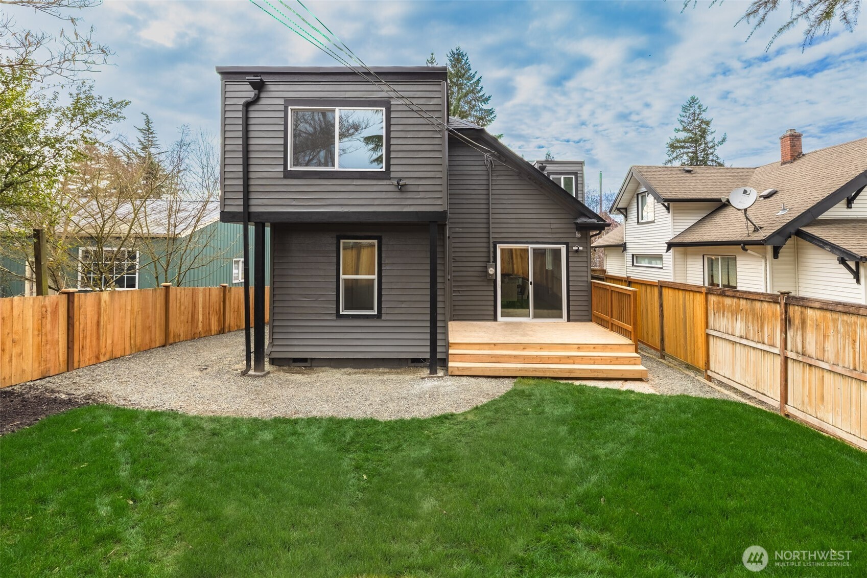 949 South Ridgewood Avenue Tacoma, WA 98405 - Photo 30 of 39 a view of house with backyard outdoor seating and hardwood