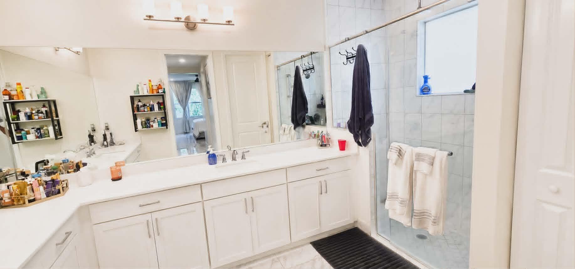 19179 Rolling Acrs Road Loxahatchee, FL 33470 - Photo 27 of 38 a bathroom with a sink and a mirror