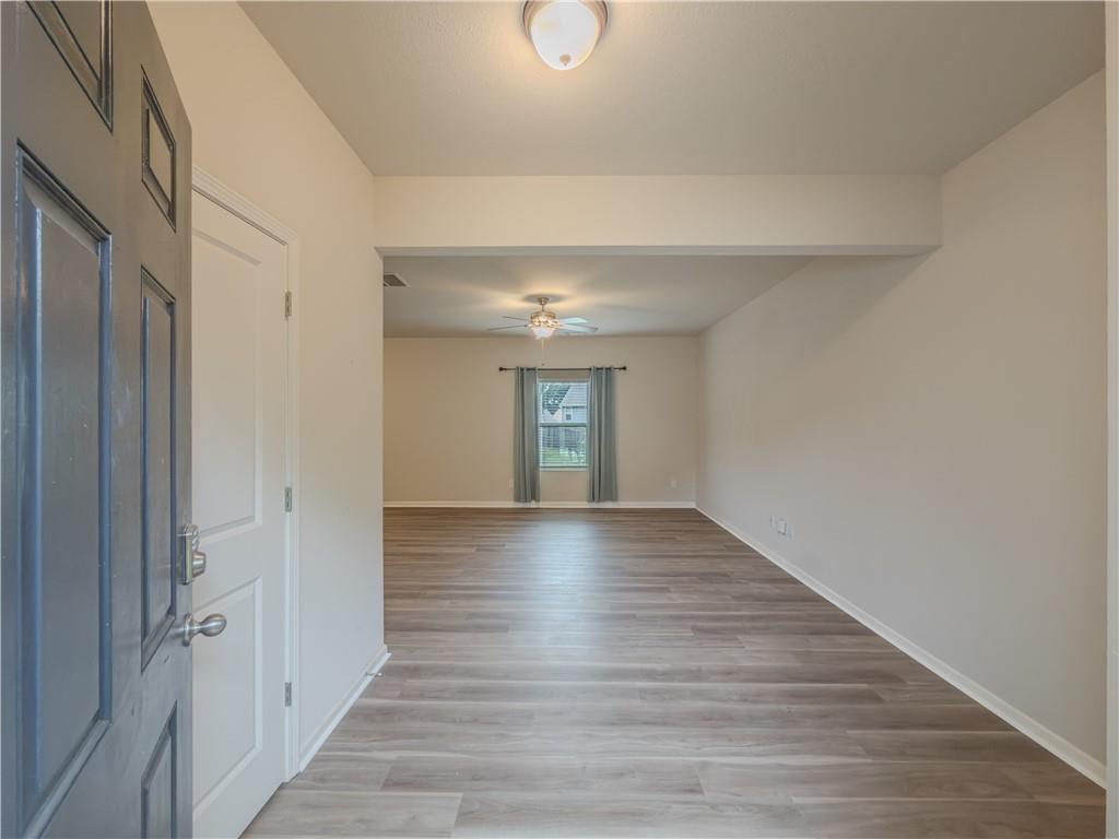 206 Morning Drive Athens, GA 30606 - Photo 7 of 36 a view of an empty room with wooden floor and a window