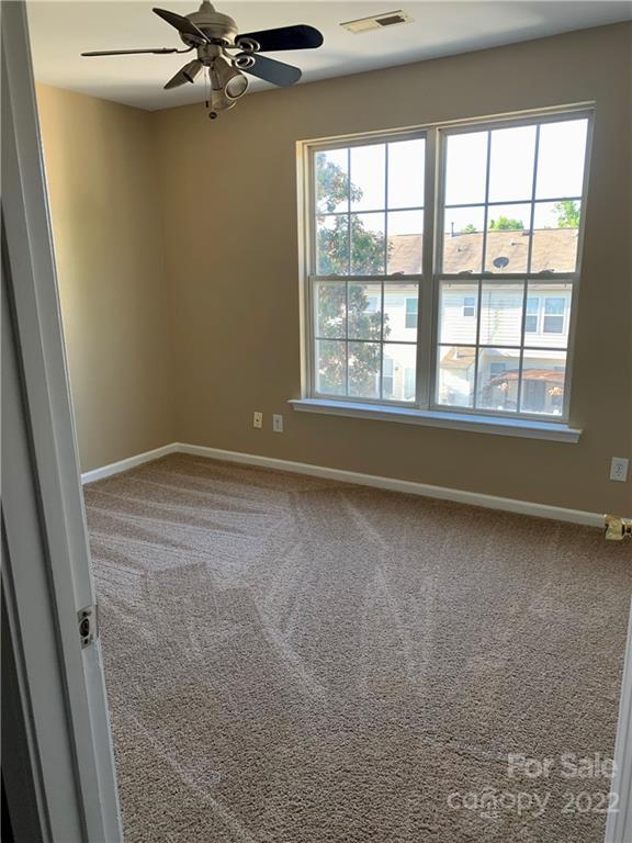927 Azurine Circle Fort Mill, SC 29708 - Photo 15 of 18 wooden floor in an empty room with a window