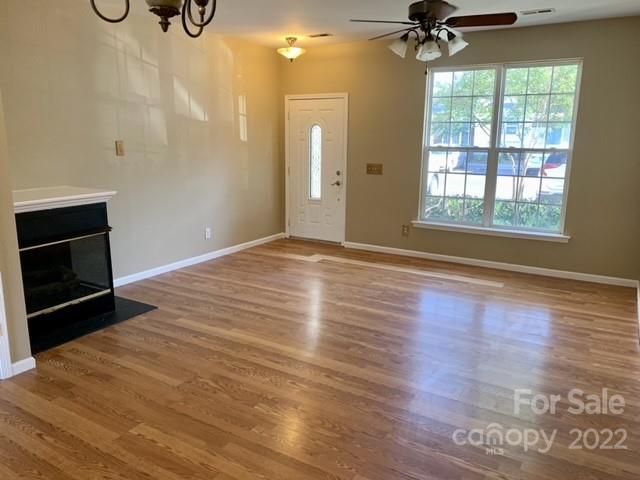 927 Azurine Circle Fort Mill, SC 29708 - Photo 2 of 18 a view of an empty room with a window and wooden floor