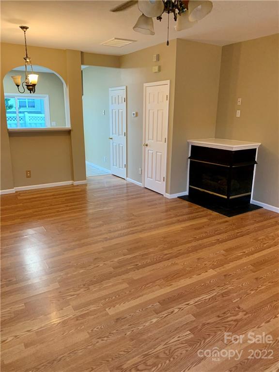 927 Azurine Circle Fort Mill, SC 29708 - Photo 3 of 18 a room with wooden floor and a ceiling fan