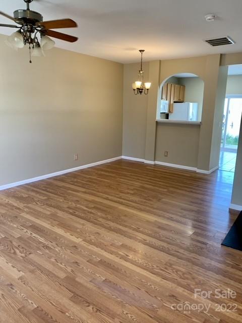 927 Azurine Circle Fort Mill, SC 29708 - Photo 4 of 18 wooden floor in an empty room with a window