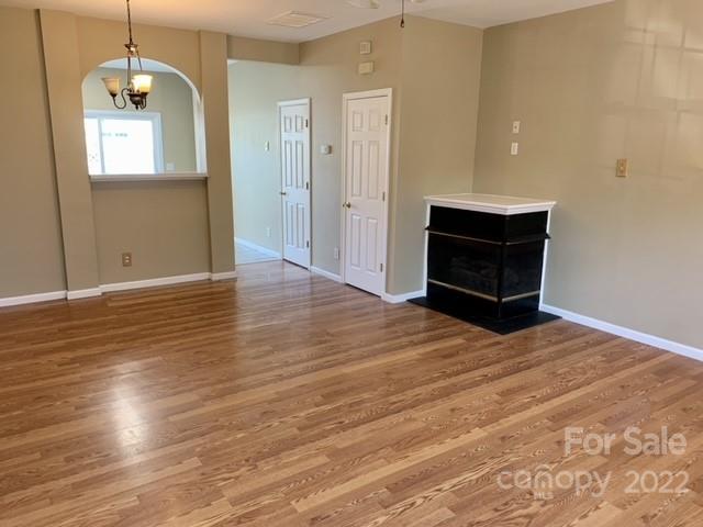 927 Azurine Circle Fort Mill, SC 29708 - Photo 5 of 18 an empty room with wooden floor and ceiling fan