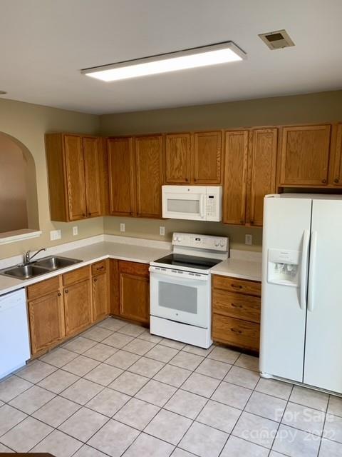 927 Azurine Circle Fort Mill, SC 29708 - Photo 7 of 18 a kitchen with granite countertop a refrigerator and a sink