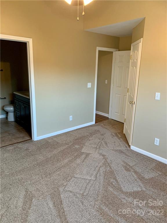 927 Azurine Circle Fort Mill, SC 29708 - Photo 9 of 18 a view of an empty room with closet and a bathroom