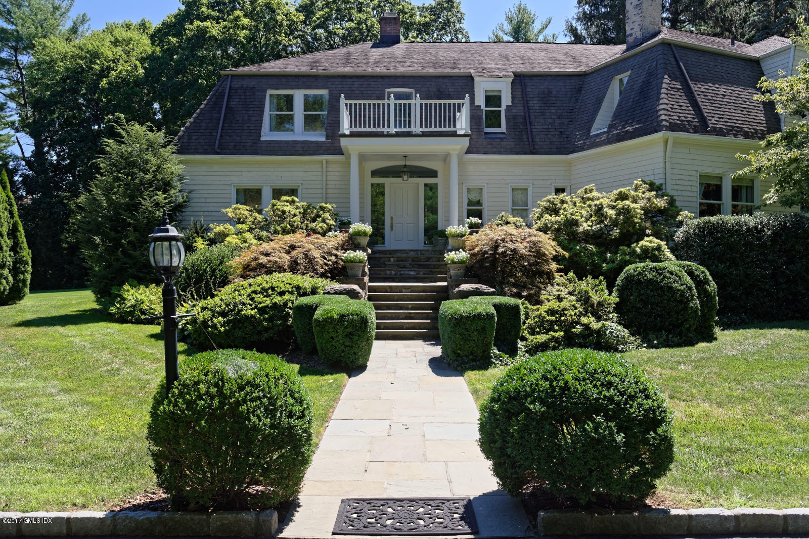 171 North Maple Avenue Greenwich, CT 06830 - Photo 1 of 16 a view of a house with a yard and potted plants