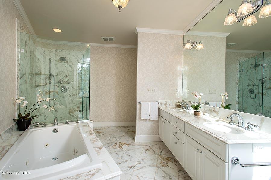 171 North Maple Avenue Greenwich, CT 06830 - Photo 11 of 16 a bathroom with a large tub shower and sink