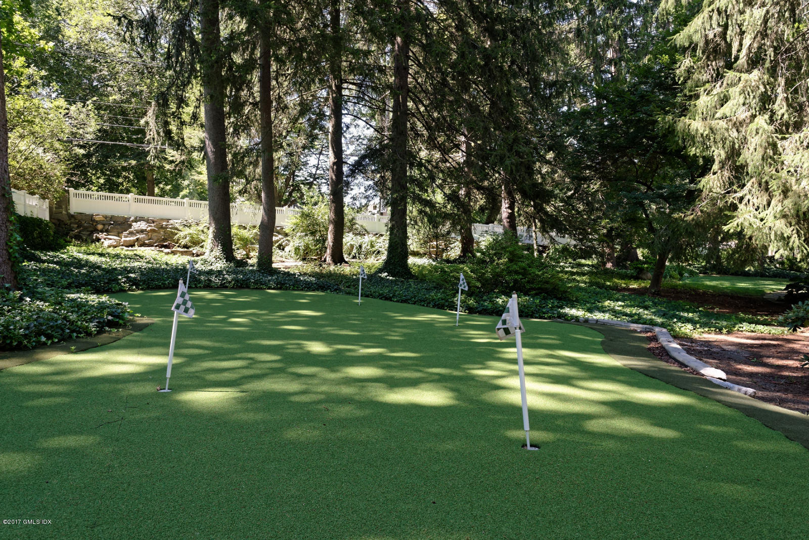 171 North Maple Avenue Greenwich, CT 06830 - Photo 16 of 16 a swimming pool with lots of trees in the background