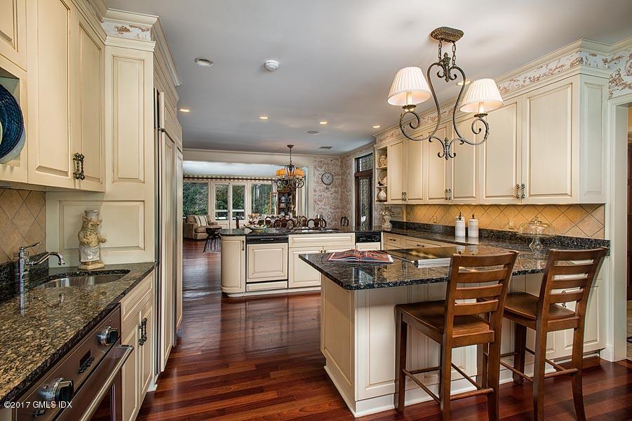 171 North Maple Avenue Greenwich, CT 06830 - Photo 7 of 16 a kitchen with stainless steel appliances granite countertop a stove a sink and a refrigerator