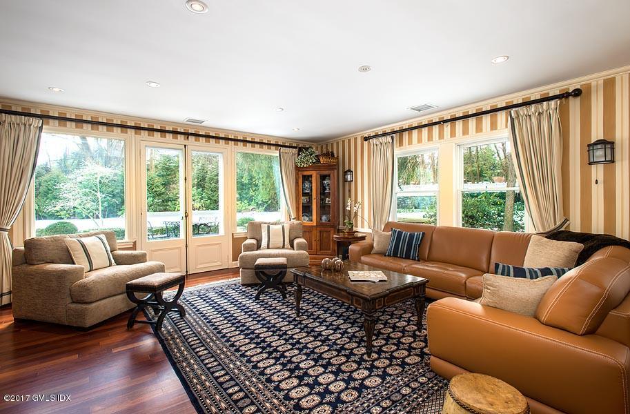 171 North Maple Avenue Greenwich, CT 06830 - Photo 9 of 16 a living room with furniture and a large window