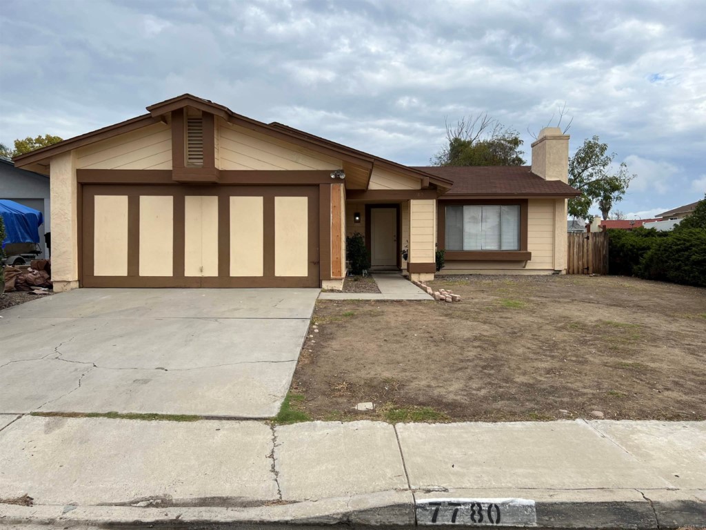 7780 Embry Point San Diego, CA 92126 - Photo 14 of 14 a front view of a house with a yard