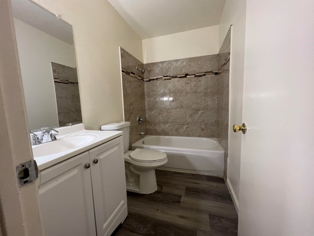 7780 Embry Point San Diego, CA 92126 - Photo 7 of 14 a bathroom with a sink toilet and shower