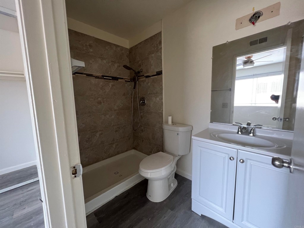 7780 Embry Point San Diego, CA 92126 - Photo 10 of 14 a bathroom with a toilet sink and shower